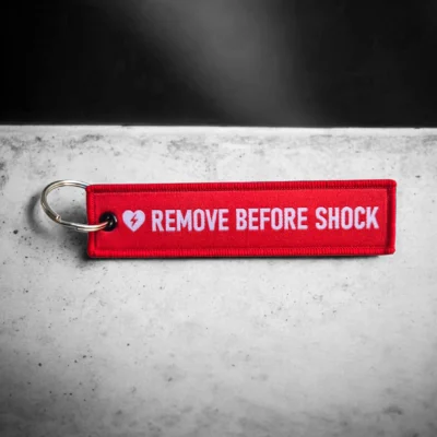 "Remove before shock" - Schlüsselanhänger